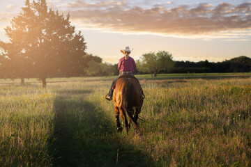 Youth cowgirl girl riding bay quarter horse western