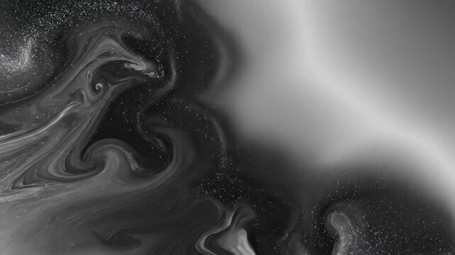 Abstract ink flow with sparkles on grayscale background, swirling and mixing for dreamy, fluid patterns
