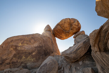Sun Burst Over Balanced Rock On Blue Sky Day