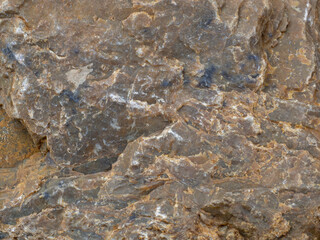 Brown stone background, rock surface. Stone texture, wallpaper.