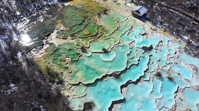 Panorama of multi-colored pond of Huanglong Scenic and Historic Interest Area