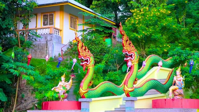 Suwankeereewong Temple green naga statue statues sculpture sculptures Phuket Thailand.