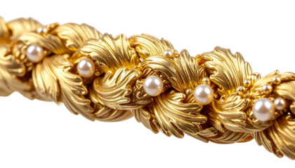 Close-up of ornate gold jewelry with embedded pearls