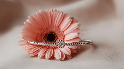 Silver Bracelet with Decorative Detail Against Pink Gerbera Flower