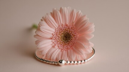 Elegant Silver Bracelet with Pink Gerbera Flower on Soft Background