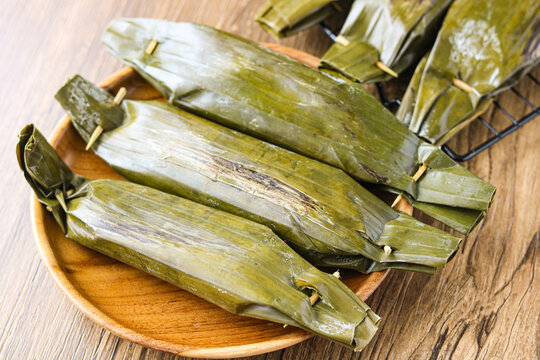 Delicious Pepes Tahu (Indonesian steamed or grilled tofu in banana leaves). Inside the banana leaves are savory, silken tofu mashed with aromatic spices.