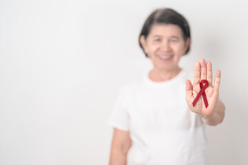 Elderly with Burgundy Ribbon for March Multiple Myeloma Cancer Awareness month, September Sickle Cell Anemia, Headache and Migraine week, April world Meningitis day, October Hospice  Palliative care