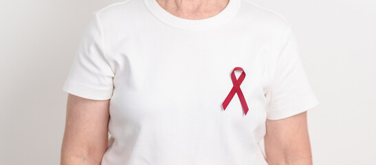 Elderly with Burgundy Ribbon for March Multiple Myeloma Cancer Awareness month, September Sickle Cell Anemia, Headache and Migraine week, April world Meningitis day, October Hospice  Palliative care