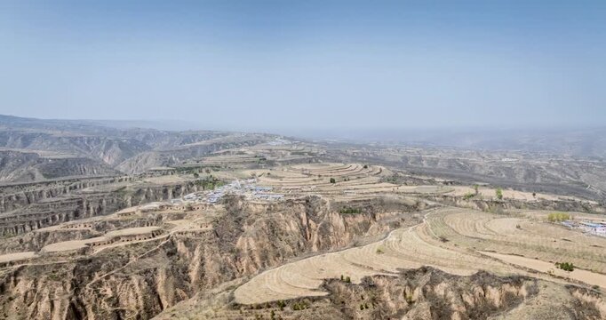 Aerial time-lapse of loess ridge landscapes in Yan&rsquo;an&mdash;dramatic terrains of China&rsquo;s arid northwest under spring sky.