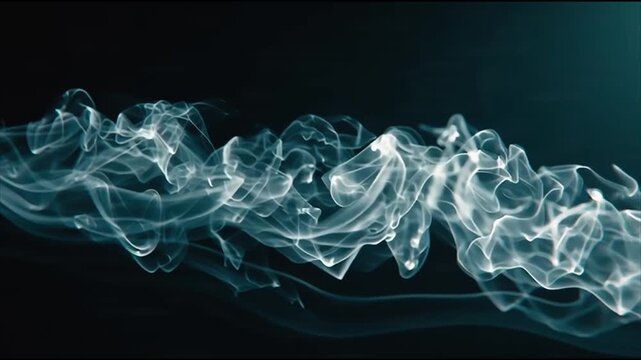 Wispy white smoke swirling in fluid motion against a dark background with blue undertones des