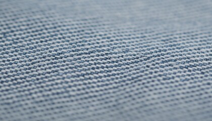 Close-up view of denim fabric texture, showcasing the weave and shades of blue and white