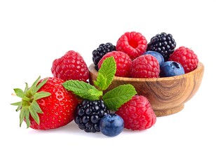 Assortment of fresh berries, including raspberries, blackberries, blueberries, and a strawberry, in a wooden bowl with mint