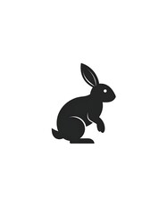 Obraz premium A simple, minimalist silhouette of a rabbit in black against a clean white background. It's in a side-facing, seated position