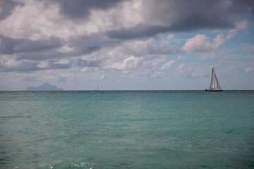 Resorts, waves and soft sand at Maho Beach in St. Maarten, a famous destination for sunbathing, swimming, and plane spotting.
