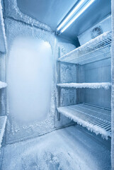 Empty Frosty Freezer Interior with Ice Buildup and Copy Space Background