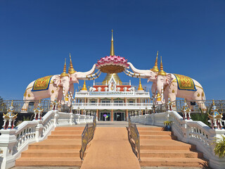 Wat Than Thahan. The temple is known for its distinctive architecture featuring large, pink elephant statues as part of the main entrance and structure. Nakhon Sawan Province, Thailand.