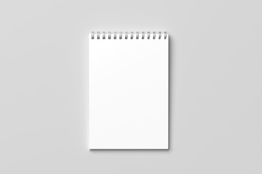 Top view Blank realistic spiral bound notepad mockup of a spiral notebook isolated on a minimalist gray background.