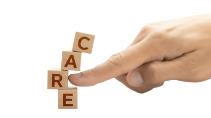 A hand placing wooden blocks with the word CARE on a black background
