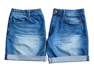 Two denim shorts, front and back view, with folded cuffs, on white