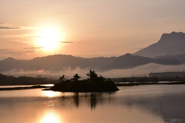 Obraz premium Reservoir with a mountain backdrop,reservoir featuring a large mountain formation in the background, Khlong Hin Reservoir, Krabi