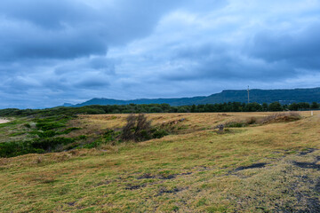 Fototapeta premium Woonona Beach north of Wollongong, New South Wales, Australia, with a family friendly sandy shoreline, ocean surf, calm swimming areas and the elevated Woonona Rock Pool, photographed January 3, 2026.