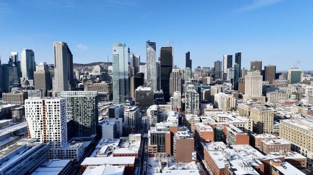 Downtown Montreal skyline with modern skyscrapers and winter cityscape under clear blue sky, Quebec, Canada. g.