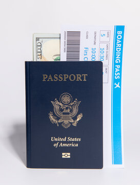 US passport with boarding pass. Travel documents for international trip. Planning trip and airport check in concept. American passport and airline tickets for vacation. Passport for travel checklist.