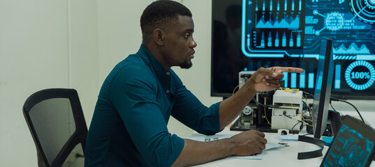 Black engineers are programming in an academic classroom for learning	