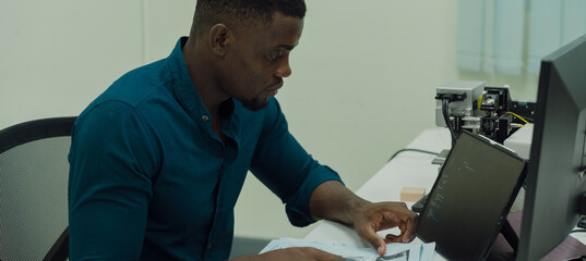 Black engineers are programming in an academic classroom for learning	