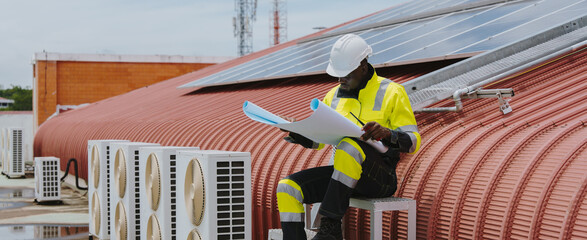 Engineers are checking the air conditioning and cooling system in a commercial building.(PHOTO)