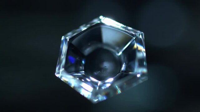 crystal gemstone diamond faceted jewel precious stone sparkle glitter refraction reflection prism macro close up rotating dark