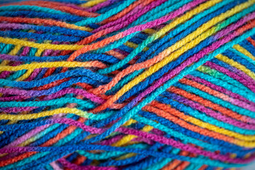 Fototapeta premium Close up of colorful knitting yarn. Colorful wool texture. Close up of colorful fabric.
