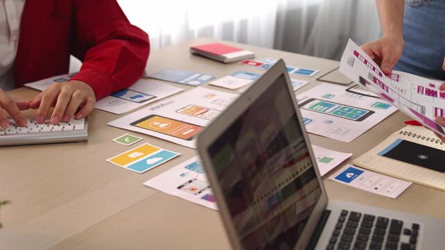 Panorama video of startup company employee planning on user interface prototype for mobile application or website in office. UX UI designer brainstorm designing user friendly interface plan. Synergic