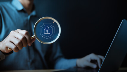Cybersecurity and data protection concept showing digital lock and shield through magnifying glass, representing encryption, privacy, secure access, and protection against cyber threats.