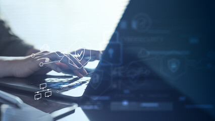 Hands typing on laptop with digital security icons, representing cloud security, data protection, cybersecurity system, secure access, and network defense for modern enterprise technology.
