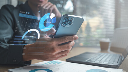 Person using smartphone with personal finance dashboard showing budget, expense tracking, and spending analytics, representing money management, savings planning, and digital financial control.