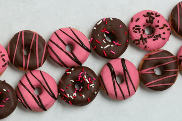 Diagonal Assorted Pink and Chocolate Donuts with Sprinkles