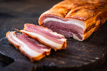 Smoked pork belly on cutting board