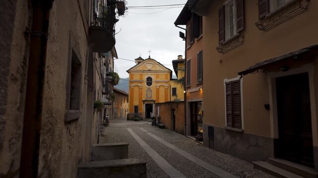 Narrow Street Towards The Church Of San Rocco (Oratorio di San Rocco) In Orta San Giulio, Italy. POV Shot