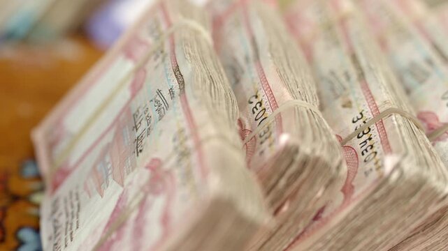 Closeup of Nepali currency, stack of banknotes