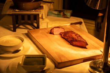 cooked steak on a chopping board 