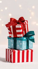 Vertical stack of holiday gifts with red stripes and green stars used as a festive mobile app wallpaper background with empty copy space on top for text