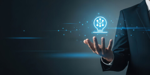 Creativity idea growth business brain with bulb light innovative innovation creative inspiration success glowing over open hand of businessman in dark suit background