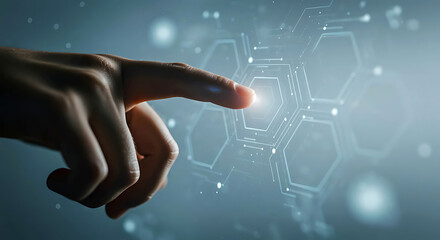 Hand pointing to glowing hexagon on circuit board background with blue gradient finger