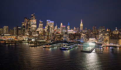 Fototapeta premium New York City panoramic skyline. NYC aerial skyline over downtown Manhattan. NewYork night skyline. New York skyline with Tower. NYC cityscape. New York waterfront. New York aerial view.