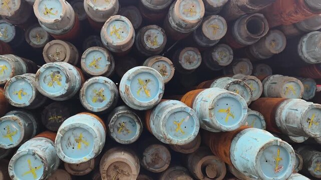 Stack of oilfield drill pipe on the main deck of offshore drilling rig
