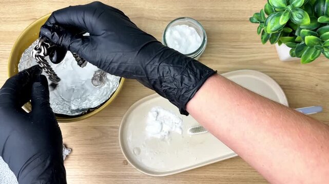 The process of cleaning silver with soda from black plaque at home.