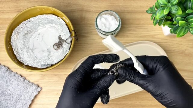 The process of cleaning silver with soda at home.