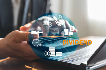 Dividend Investment Returns Concept with Calculator and Financial Icons on Laptop