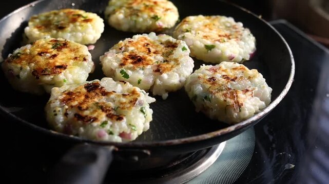 Sabudana tikki or vada being made on a pan